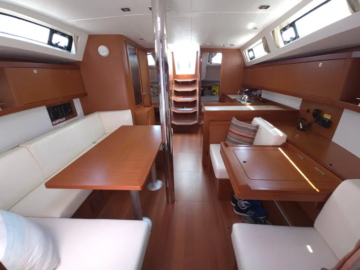 Sabrina Yacht Photos Pics Interior of 2013 Beneteau Oceanis 41 sailboat, featuring wood finish and comfortable seating.