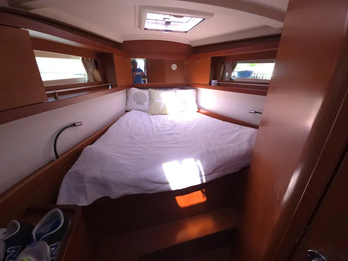 Sabrina Yacht Photos Pics Cozy cabin interior of 2013 Beneteau Oceanis 41 sailboat with bed and natural light.