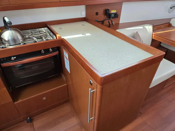 Sabrina Yacht Photos Pics Interior of 2013 Beneteau Oceanis 41 yacht kitchen with stove and countertop.