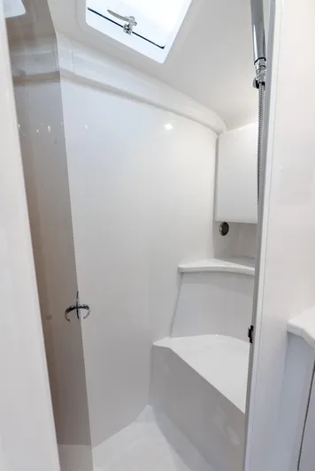  Yacht Photos Pics 2025 Intrepid 41 Valor yacht bathroom with sleek white interior design.