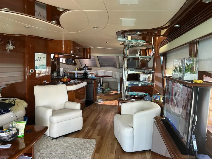 Sylvia Yacht Photos Pics Luxurious 2006 Marquis 65 yacht interior with modern furnishings and elegant wood finishes.