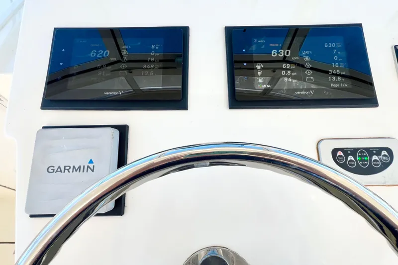 Yeah Buoy Yacht Photos Pics Steering wheel and digital displays on 2007 Albemarle 41 Express boat dashboard.