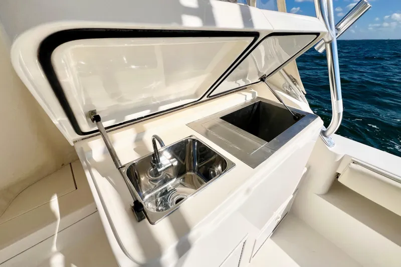 Yeah Buoy Yacht Photos Pics Outdoor sink and storage on 2007 Albemarle 41 Express boat, ocean view in background.