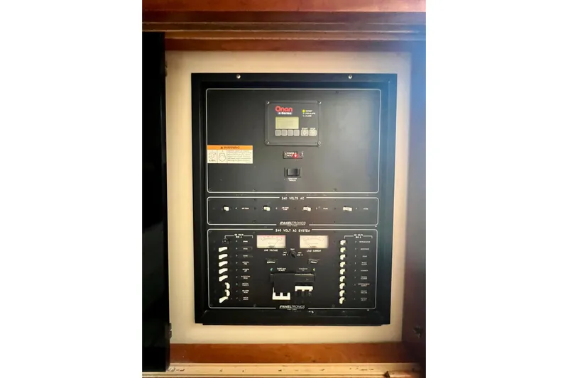 Yeah Buoy Yacht Photos Pics Electrical panel of a 2007 Albemarle 41 Express boat, featuring Onan generator controls.