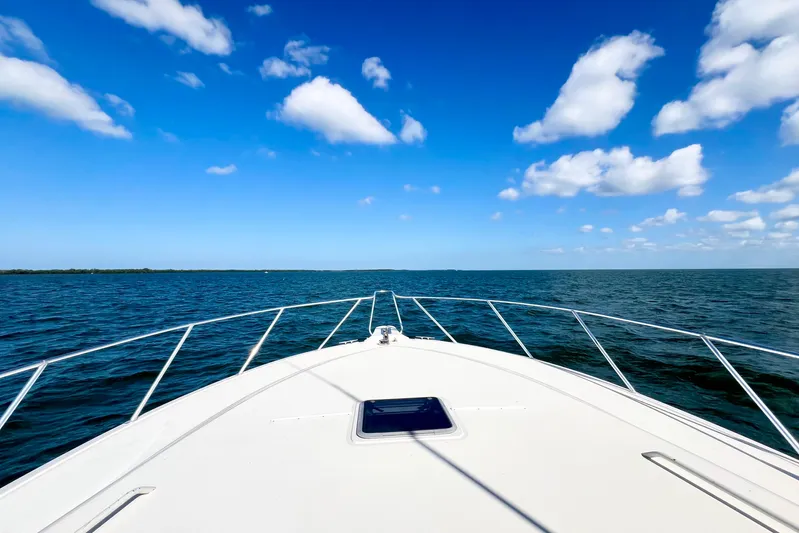Yeah Buoy Yacht Photos Pics Bow view of 2007 Albemarle 41 Express yacht on open sea under blue sky.