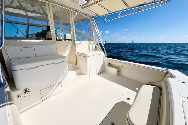 Yeah Buoy Yacht Photos Pics 2007 Albemarle 41 Express boat interior with ocean view, featuring spacious seating and storage.