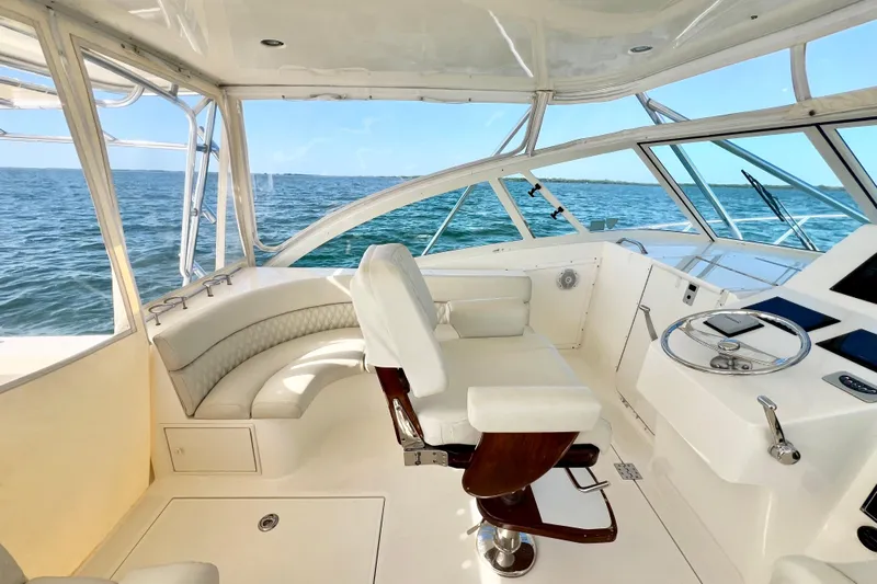 Yeah Buoy Yacht Photos Pics 2007 Albemarle 41 Express yacht interior with helm and seating, overlooking the ocean.