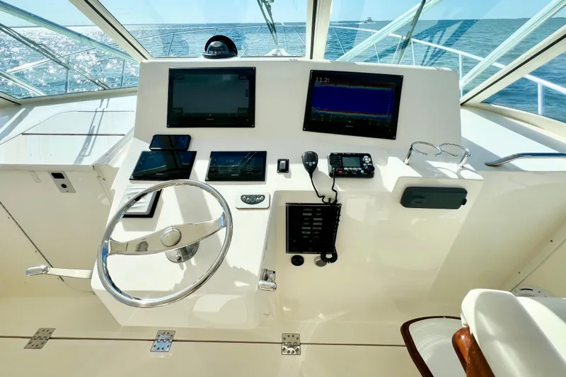 Yeah Buoy Yacht Photos Pics Helm of 2007 Albemarle 41 Express boat with modern navigation equipment and ocean view.