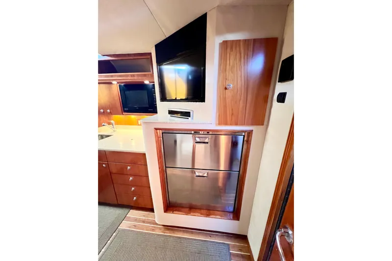 Yeah Buoy Yacht Photos Pics 2007 Albemarle 41 Express yacht interior with modern kitchen appliances and wood cabinetry.