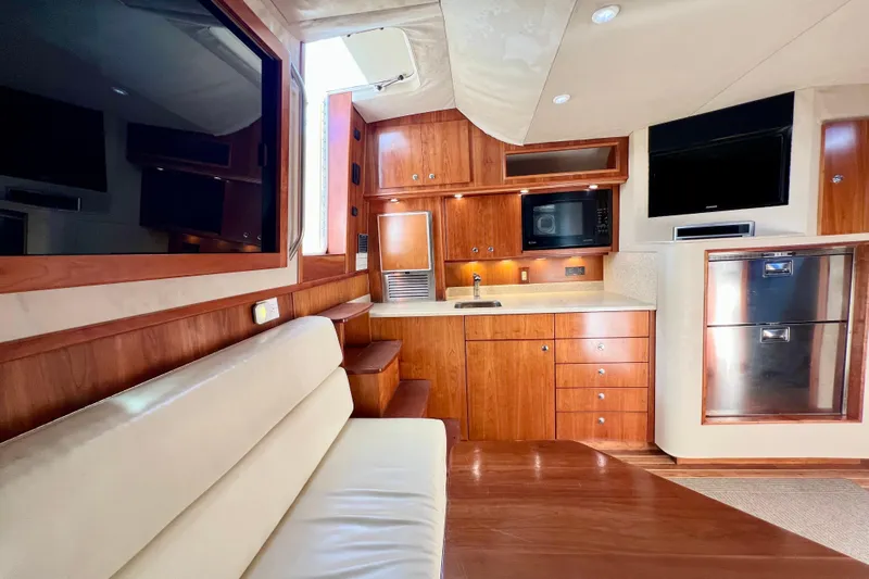 Yeah Buoy Yacht Photos Pics Interior of 2007 Albemarle 41 Express yacht with wooden cabinetry and modern amenities.