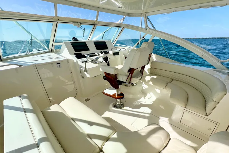 Yeah Buoy Yacht Photos Pics Luxurious 2007 Albemarle 41 Express yacht interior with plush seating and modern helm.
