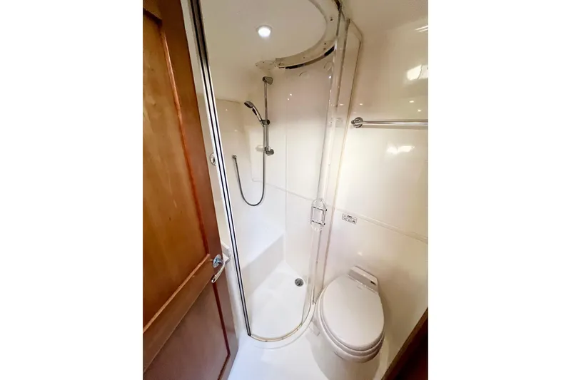 Yeah Buoy Yacht Photos Pics Compact bathroom in 2007 Albemarle 41 Express yacht with shower and toilet.