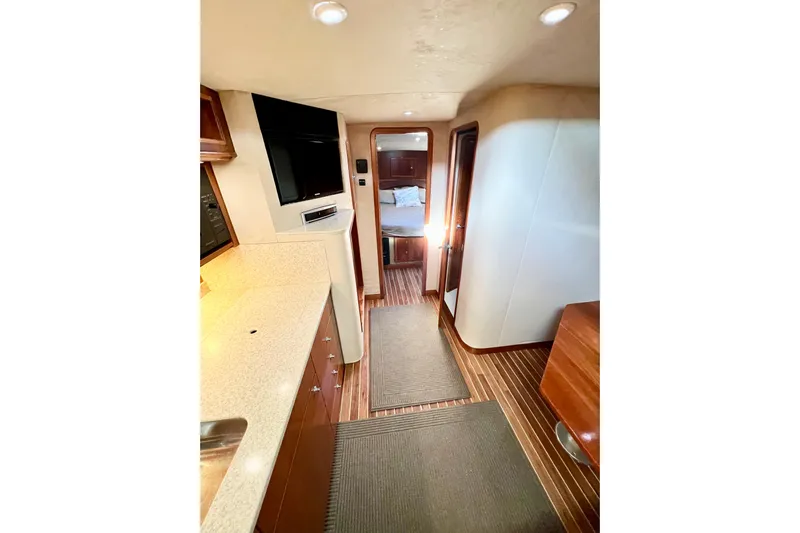 Yeah Buoy Yacht Photos Pics Interior of 2007 Albemarle 41 Express yacht with modern amenities and wood flooring.