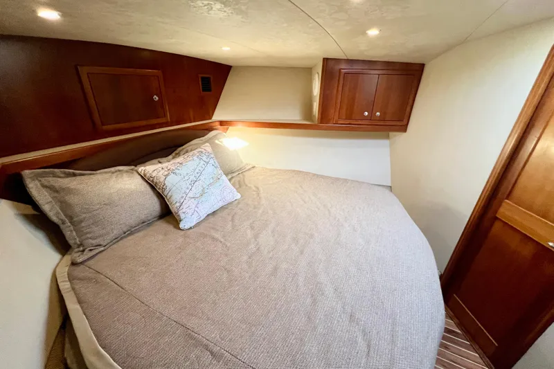 Yeah Buoy Yacht Photos Pics Luxurious cabin interior of 2007 Albemarle 41 Express yacht with cozy bedding.