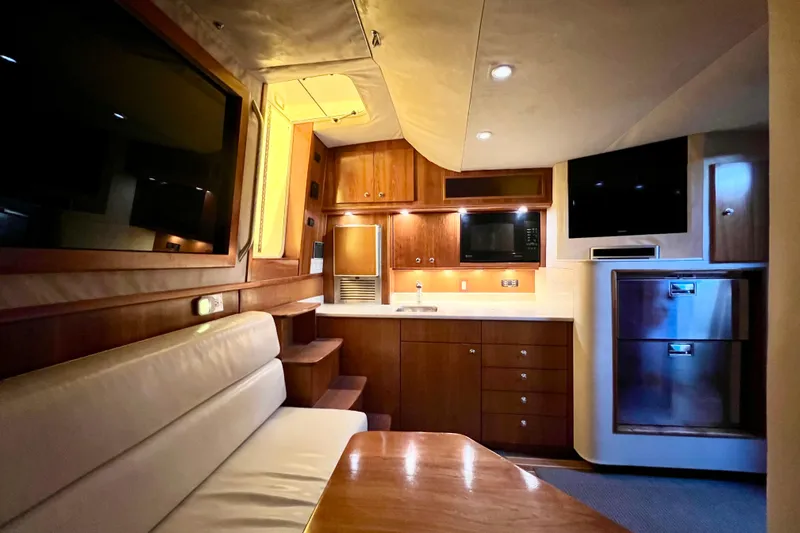 Yeah Buoy Yacht Photos Pics Luxurious interior of a 2007 Albemarle 41 Express yacht with modern amenities and wood finishes.