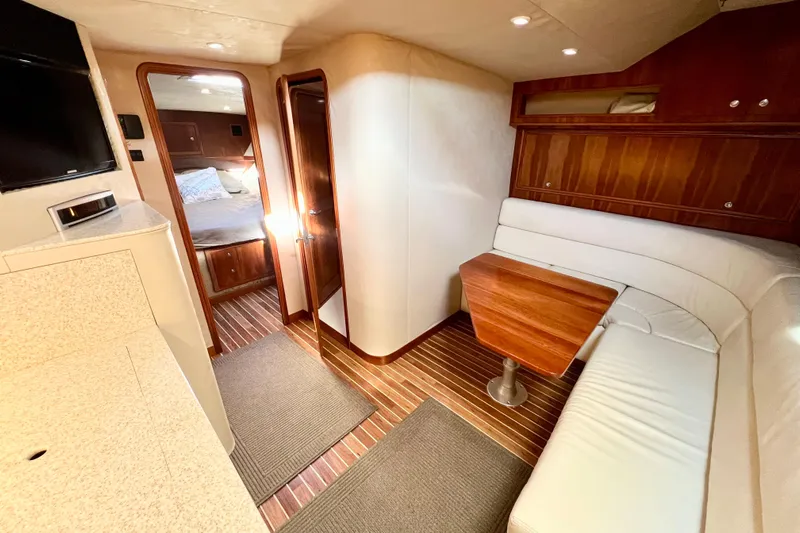 Yeah Buoy Yacht Photos Pics Luxurious interior of 2007 Albemarle 41 Express yacht with wood accents and cozy seating.
