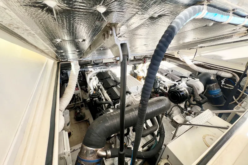 Yeah Buoy Yacht Photos Pics Engine room of 2007 Albemarle 41 Express boat, showcasing mechanical components and insulation.