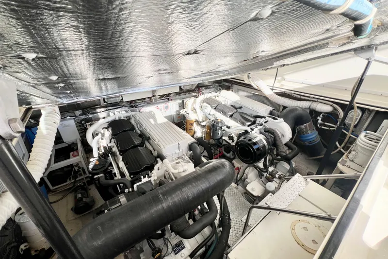 Yeah Buoy Yacht Photos Pics Engine room of a 2007 Albemarle 41 Express boat, showcasing dual engines and mechanical components.