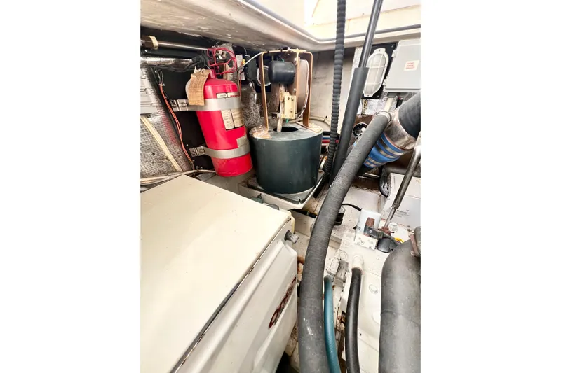 Yeah Buoy Yacht Photos Pics Engine room of 2007 Albemarle 41 Express with fire extinguisher and mechanical components.