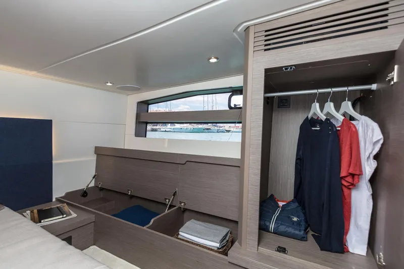 In Stock Yacht Photos Pics 2024 Beneteau Gran Turismo 45 cabin interior with wardrobe and storage space.