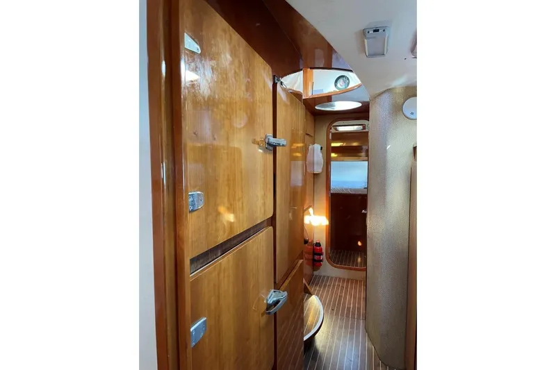 Southern Pearl Yacht Photos Pics Interior of 2001 Privilege 435 yacht with wooden cabinetry and modern design.