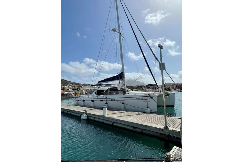 Southern Pearl Yacht Photos Pics 2001 Groupe Alliura Marine Privilege 435 catamaran docked at marina under clear sky.