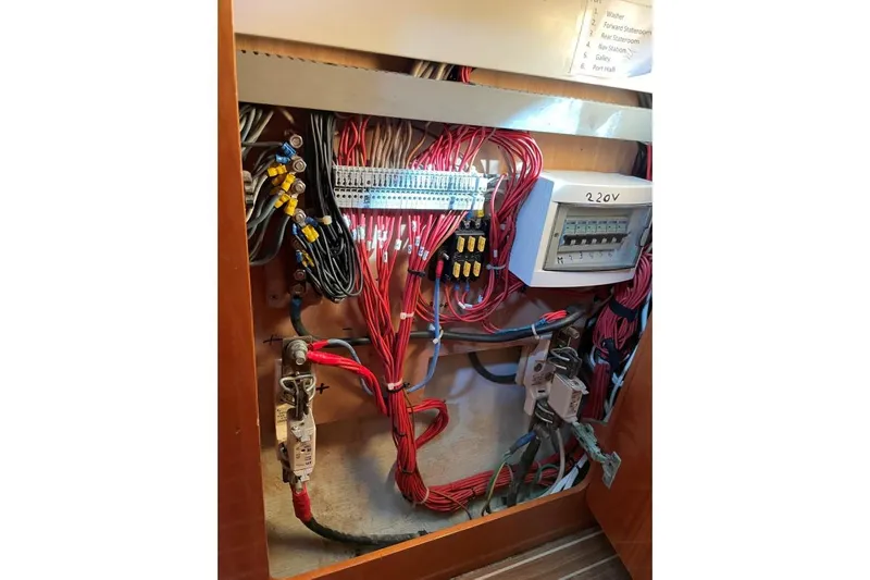 Southern Pearl Yacht Photos Pics Electrical panel of 2001 Groupe Alliura Marine Privilege 435 yacht, showcasing wiring and circuit breakers.