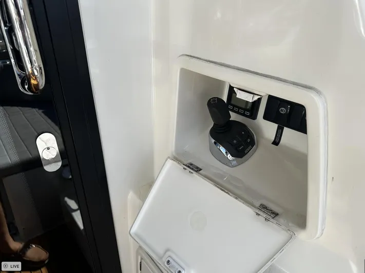  Yacht Photos Pics Control panel of a 2018 Prestige 460S Coupé yacht, featuring joystick and switches.