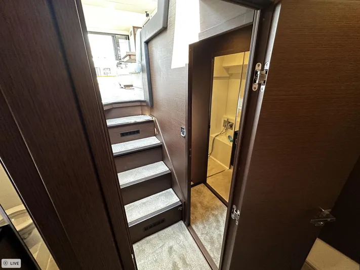  Yacht Photos Pics Interior of 2018 Prestige 460S Coupé yacht, featuring stairs and a doorway.