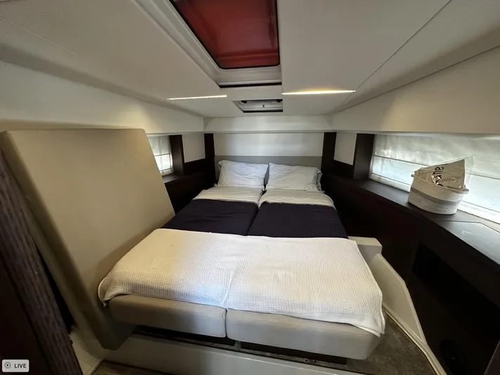  Yacht Photos Pics Luxurious bedroom interior of 2018 Prestige 460S Coupé yacht with cozy bedding.