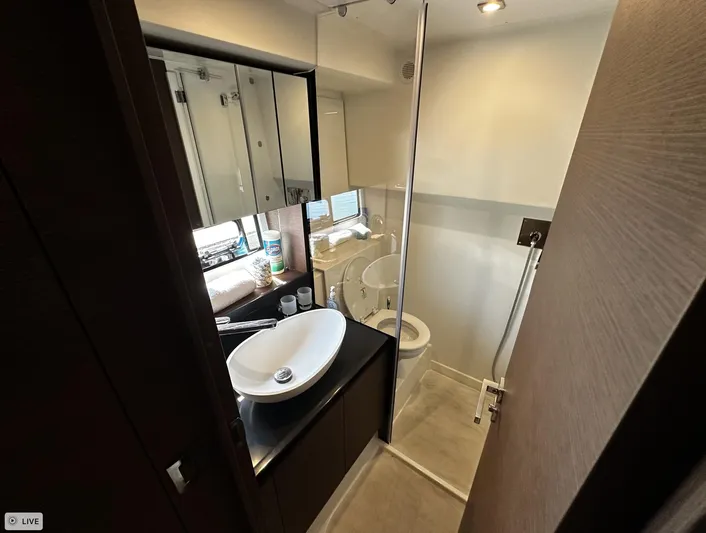  Yacht Photos Pics Luxurious bathroom in 2018 Prestige 460S Coupé yacht with modern fixtures and elegant design.