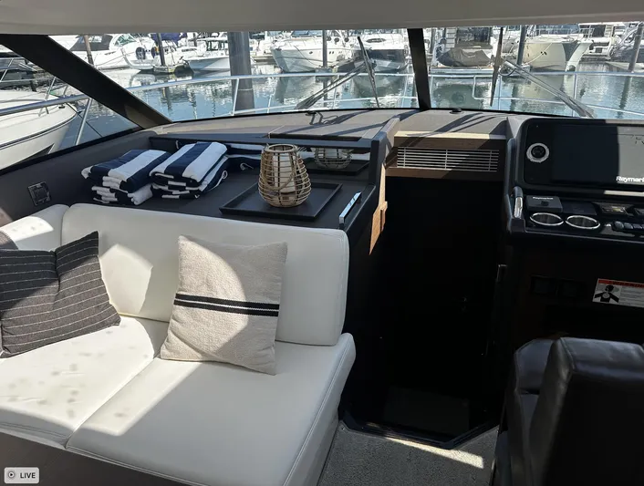  Yacht Photos Pics Interior of 2018 Prestige 460S Coupé yacht with elegant seating and marina view.