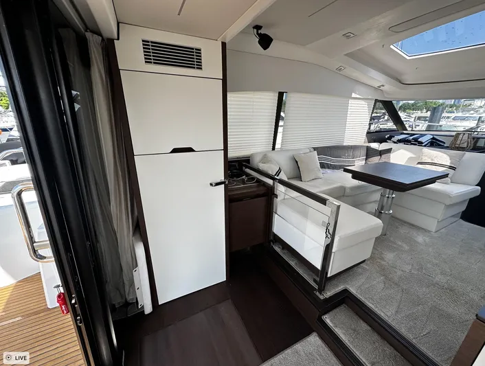  Yacht Photos Pics Luxurious interior of 2018 Prestige 460S Coupé yacht with modern seating and dining area.