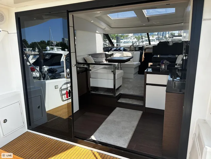  Yacht Photos Pics Interior view of a 2018 Prestige 460S Coupé yacht with modern furnishings.