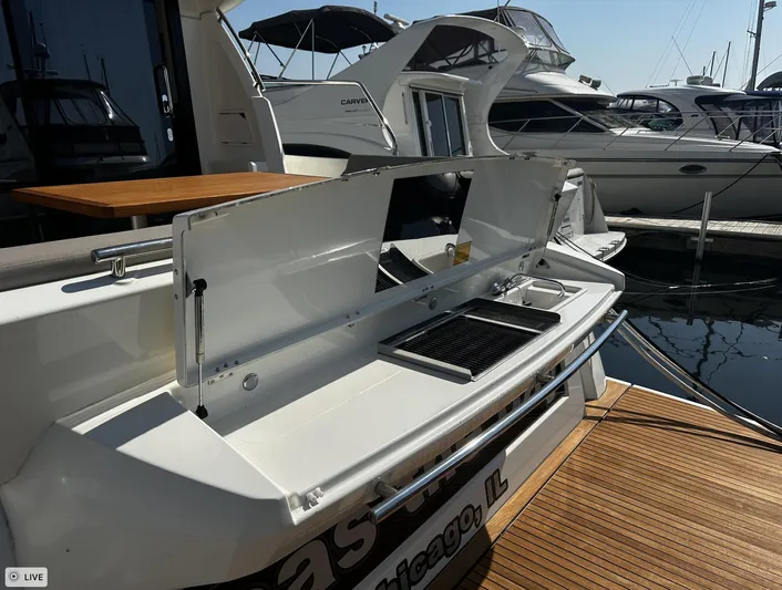  Yacht Photos Pics 2018 Prestige 460S Coupé yacht with open outdoor kitchen at marina.
