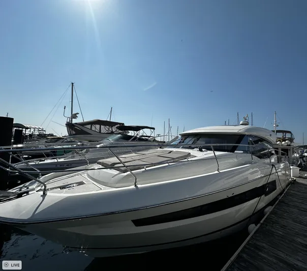  Yacht Photos Pics 2018 Prestige 460S Coupé yacht docked under clear blue sky.