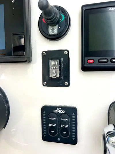 Reel Life Yacht Photos Pics Control panel of a 2015 Jupiter 41SB boat with various switches and displays.