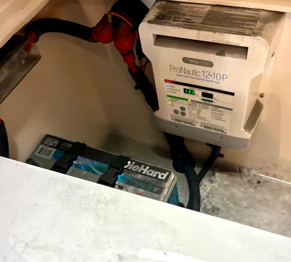 Reel Life Yacht Photos Pics Boat battery compartment with ProNautic charger and DieHard battery, Jupiter 41SB, 2015 model.
