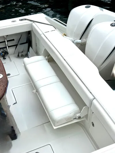 Reel Life Yacht Photos Pics 2015 Jupiter 41SB boat interior with white seating and dual outboard motors.