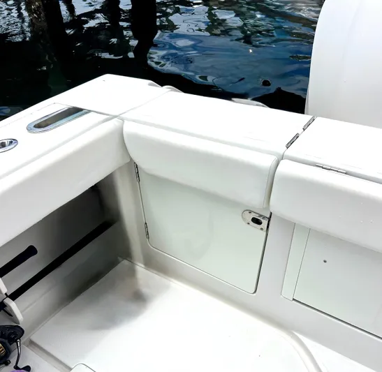 Reel Life Yacht Photos Pics 2015 Jupiter 41SB boat interior with white seating and storage compartments.