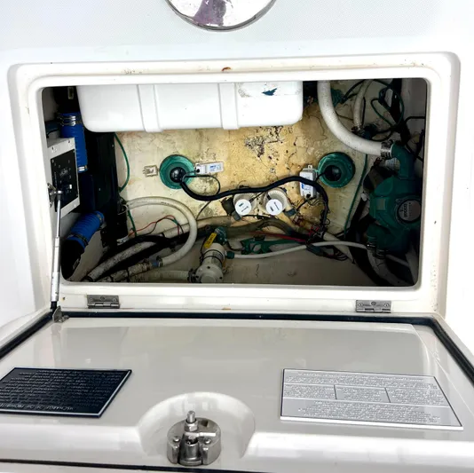 Reel Life Yacht Photos Pics Engine compartment of a 2015 Jupiter 41SB boat, showing wiring and components.