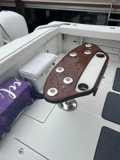 Reel Life Yacht Photos Pics Luxury boat interior with a polished wooden table, Jupiter 41SB, 2015 model.