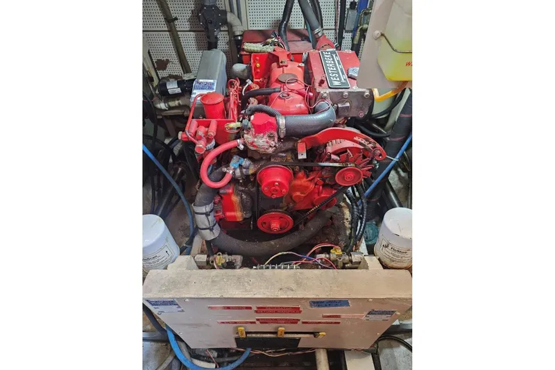 Moonshadow Yacht Photos Pics Engine room of 1985 Grand Banks 42 Classic with red Westerbeke engine.