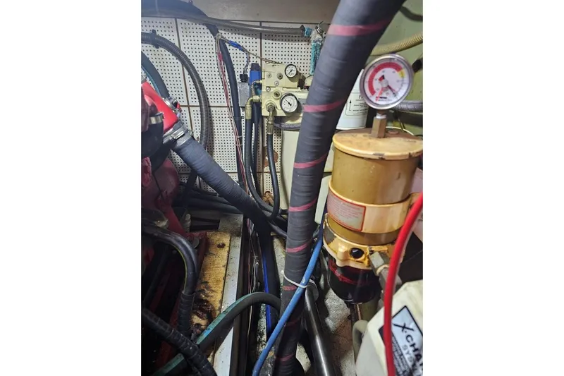 Moonshadow Yacht Photos Pics Engine room of 1985 Grand Banks 42 Classic with hoses and gauges.