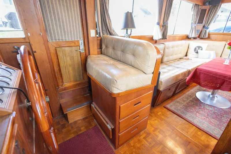 Moonshadow Yacht Photos Pics Interior of 1985 Grand Banks 42 Classic yacht with wood finish and leather seating.