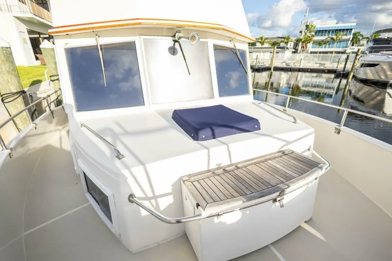 Moonshadow Yacht Photos Pics 1985 Grand Banks 42 Classic yacht deck with seating, docked at marina.