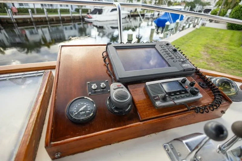 Moonshadow Yacht Photos Pics Control panel of a 1985 Grand Banks 42 Classic boat with navigation equipment.