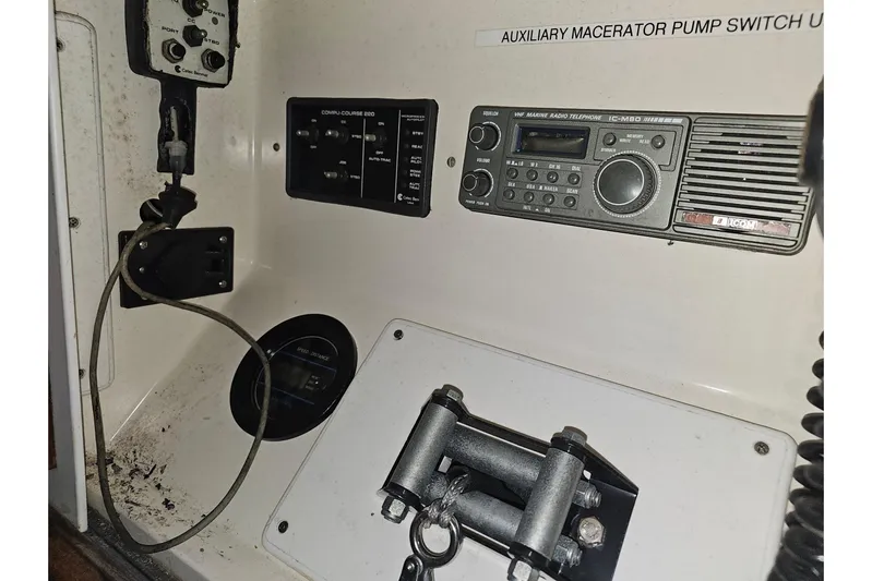 Moonshadow Yacht Photos Pics Control panel of a 1985 Grand Banks 42 Classic boat with radio and switches.