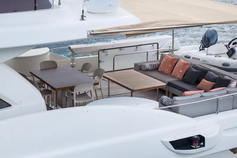  Yacht Photos Pics Luxurious 2014 Custom Line Navetta 26 Crescendo yacht with elegant outdoor seating and dining area.