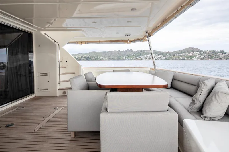  Yacht Photos Pics Luxurious 2014 Custom Line Navetta 26 Crescendo yacht deck with elegant seating and ocean view.